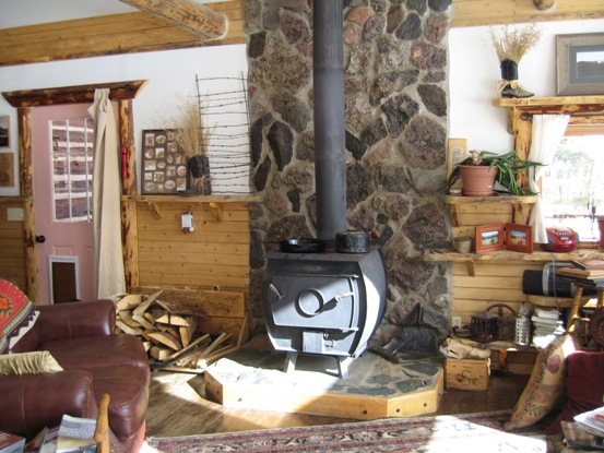 I use a wood stove, however, a corn stove is better.